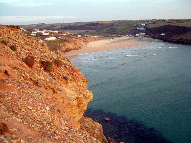 An elevated view of Mawgan Porth beach, Cornwall at high tide